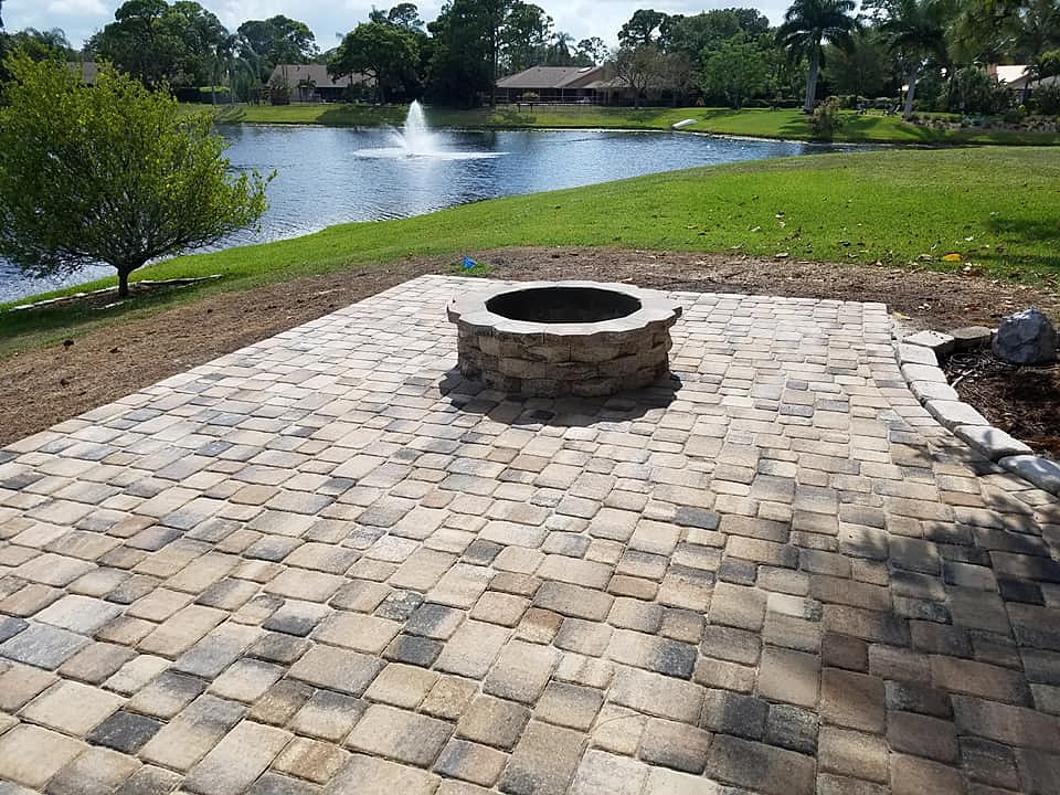 Fire Pits, Delray Beach FL A circular fire pit near a lake built by a fire pit contractor