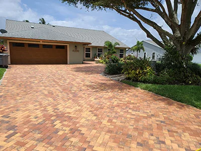 A driveway installed with brick pavers by contractors in Palm Beach County, FL