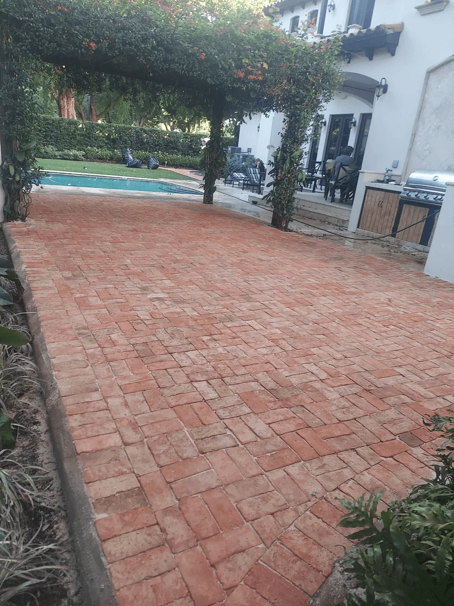Traditional clay patio pavers in backyard by pool