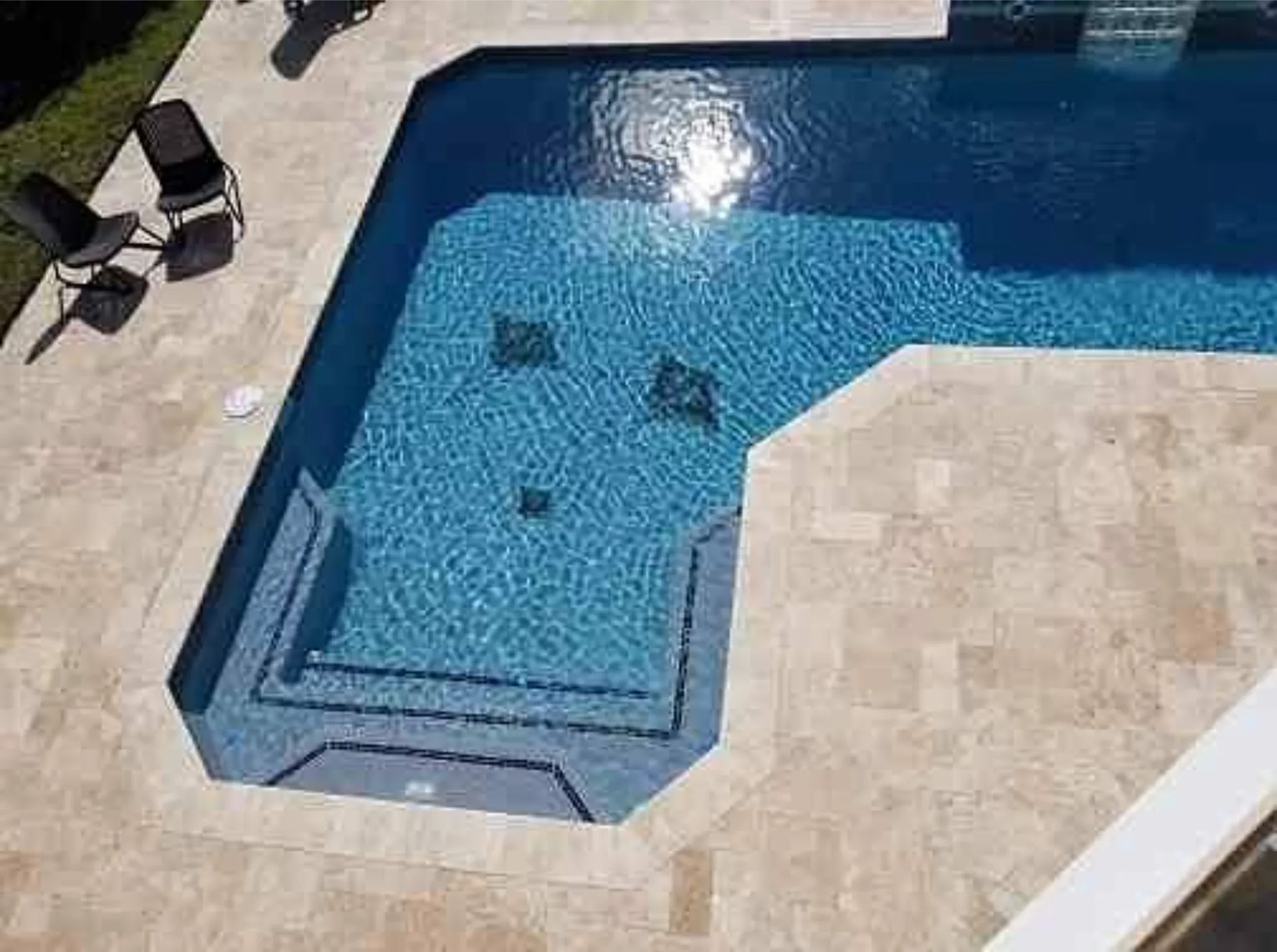 Completed job by porcelain paver installers around a Palm Beach County, FL, pool